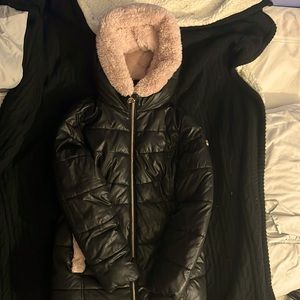 A child’s Michael Kors jacket “girls” fur hood and pockets and is snug